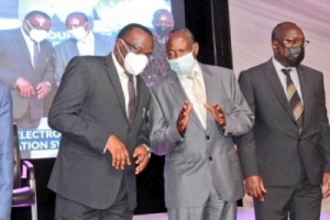 Chief Justice Owiny Dollo confers with Hon. Mata Kasaija (Minister of Finance, Planning and Economic Development) during the commissioning of ECCMIS on 20th October 2021 (PHOTO: Nile Post)